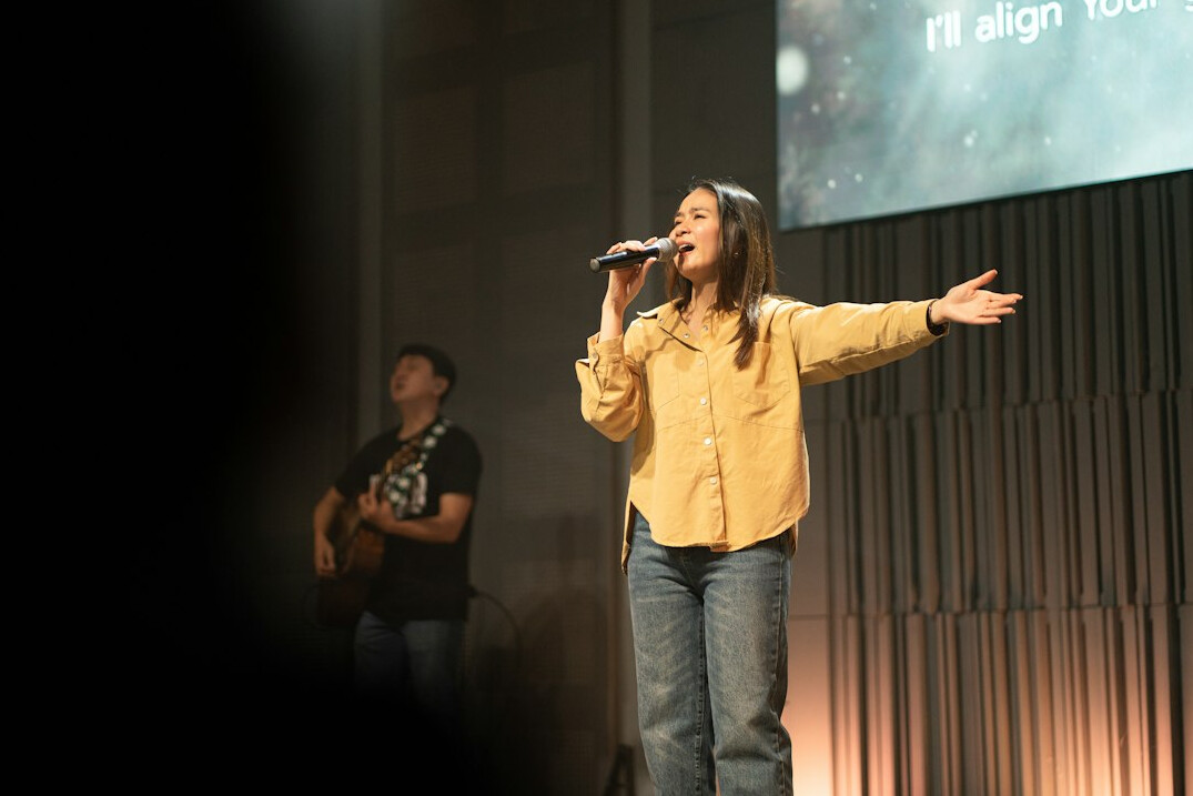 person speaking confidently on stage