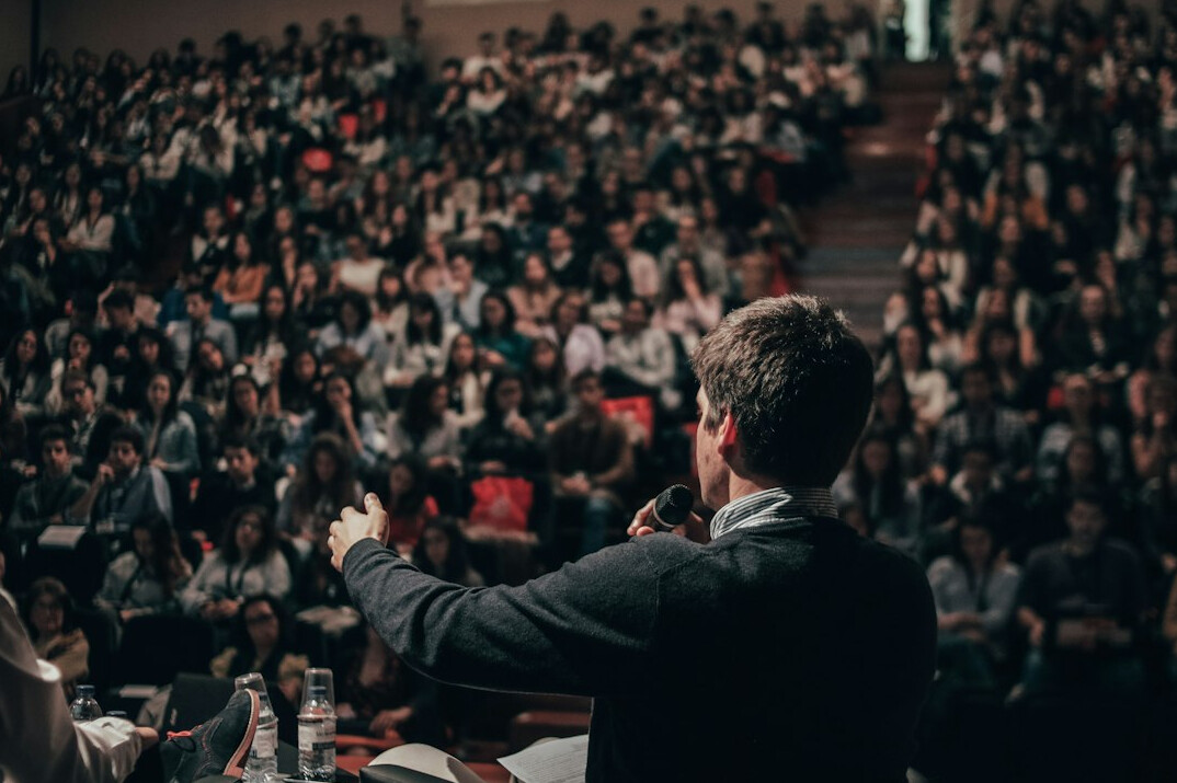 confident speaker on stage